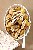 Potatoes baked with camembert and poppy seeds