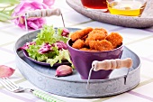 Chicken nuggets with salad