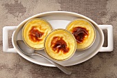 Crème caramel in three glass dishes