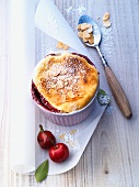 Quark soufflé with cherries and sliced almonds