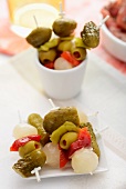 Cocktail skewers with olives, pickled gherkins and pearl onions
