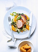 Rolled roast turkey with oranges and pointed cabbage