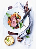 Rack of lamb with basil leaves