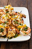 Grilled Lemon and Herb Shrimp Skewers on a White Platter