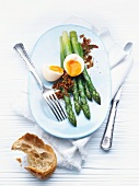 Green asparagus with soft-boiled egg and crispy bacon