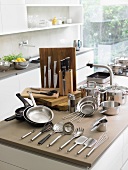 Assorted pots and pan and cooking utensils in a kitchen