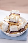 Cake with boysenberry jelly, meringue and sliced almonds