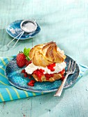 Profiterole with strawberry liqueur and strawberries