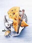 Focaccia with rosemary and garlic in a bread basket