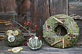 Festive, hand-crafted, scented balls and wreath of moss, wire and decorative natural items