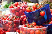 Cherry tomatoes in plastic containers at the market