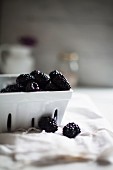 Blackberries In and Beside a Porcelain Berry Basket