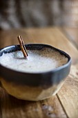 Chai Latte with Frothy Milk and a Cinnamon Stick