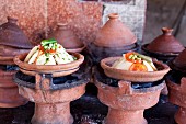 Assorted tagine dishes at a market in North Africa