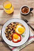 Eggs Baked in Red and Yellow Bell Peppers with Home Fries; Coffee and Orange Juice