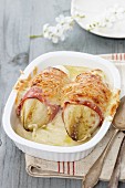 Gratinated chicory wrapped with ham