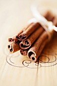 Cinnamon sticks on a wooden surface