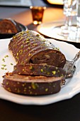Rehrücken (cake designed to look like a saddle of venison) with pistachios, partly sliced