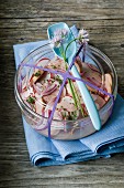 Sausage salad with radishes, onions and chives
