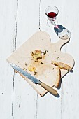 Remnants of potato pizza on a chopping board