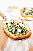 Spinach pizza with pine nuts