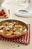 Pan-fried Spanish omelette with tomatoes and feta