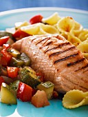 Grilled salmon with vegetables and pasta