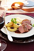 Duck breast with fried potato dumplings and cranberry sauce