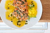 Salmon fritters with a fennel dip and orange slices
