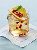 Bourbon Cocktail with Orange and Pomegranate Seeds