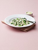 Spinach and Asparagus Risotto in a White Bowl