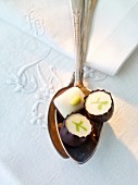 Three filled chocolates on a spoon