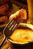 Grilled sausage on fork