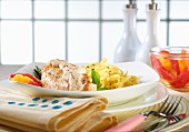 Chicken breast with a creamy sauce, ribbon pasta and citrus fruit
