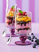 Raspberry parfait with blueberries and oranges