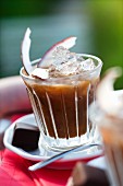 Cold coconut coffee with ice cubes