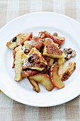 Kaiserschmarren (shredded sugared pancake from Austria) with apples and walnuts