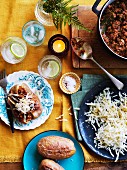 Jacket potatoes with bolognese and cheese