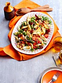 Pasta salad with tomato, rocket and egg