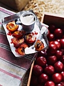 Grilled plums with cinnamon cream