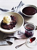 Chocolate pudding with raspberry jam and vanilla ice cream