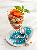A layered dessert of apricots, yoghurt and caramel