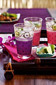Thai cocktails with mint and ice in Eastern-style glasses
