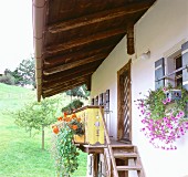 Exterior staircase of rustic whitewashed house