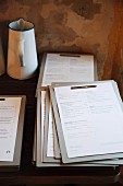 A stack of menus on clipboards