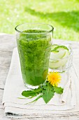 A green smoothie made from Granny Smith apples, cucumber, barley grass, dandelion leaves and young stinging nettles