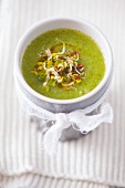 Courgette soup with edible shoots and olive oil