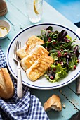 Baked halloumi and green salad with pomegranate seeds