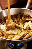 Potato gnocchi being fried