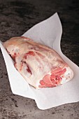 Lamb leg on baking parchment